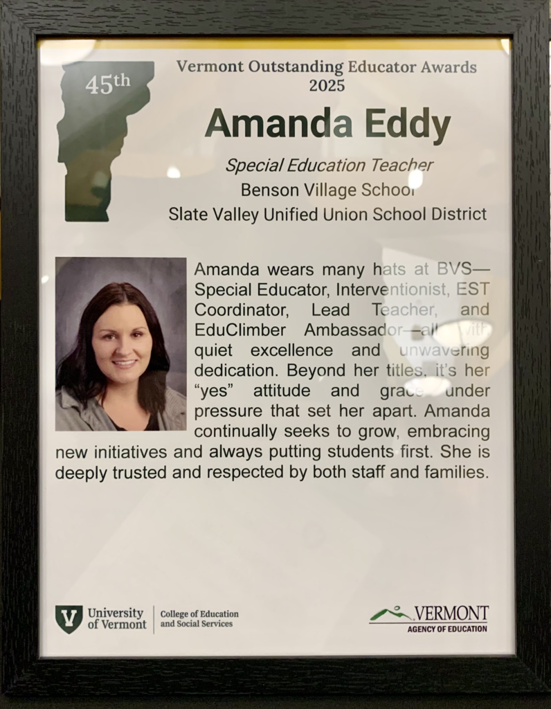 A framed Vermont Outstanding Educator Award honoring Amanda Eddy, featuring her portrait and a written tribute to her work at Benson Village School.