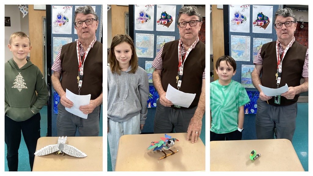 Alt text (left): A student stands with his white-and-gray owl project on a desk next to the teacher. Alt text (middle): A student stands with her rainbow-feathered bird creation on a desk next to the teacher. Alt text (right): A student stands with his small green duck project on a desk next to the teacher.