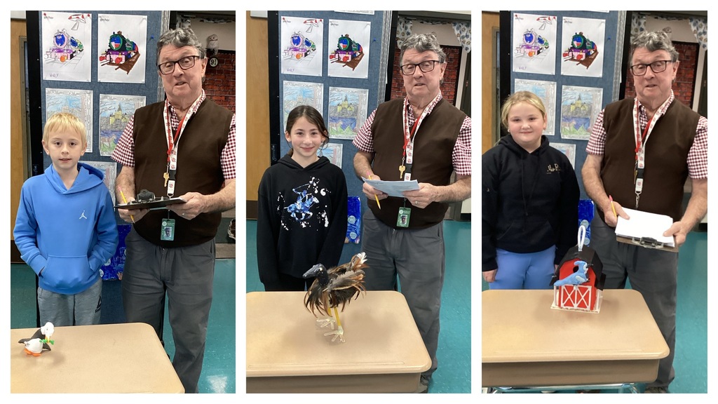 Alt text (left): A student stands next to his small puffin-style clay bird on a desk beside the teacher. Alt text (middle): A student stands beside her brown feathered bird on tall legs next to the teacher. Alt text (right): A student stands with her birdhouse-style project featuring a blue bird next to the teacher.