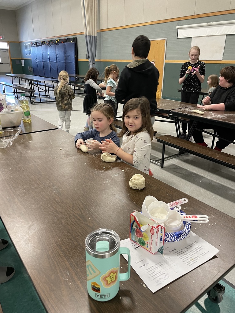 These images capture a collaborative "Easy No-Cook DIY Playdough" workshop involving children and teenagers in a school cafeteria or gymnasium setting.