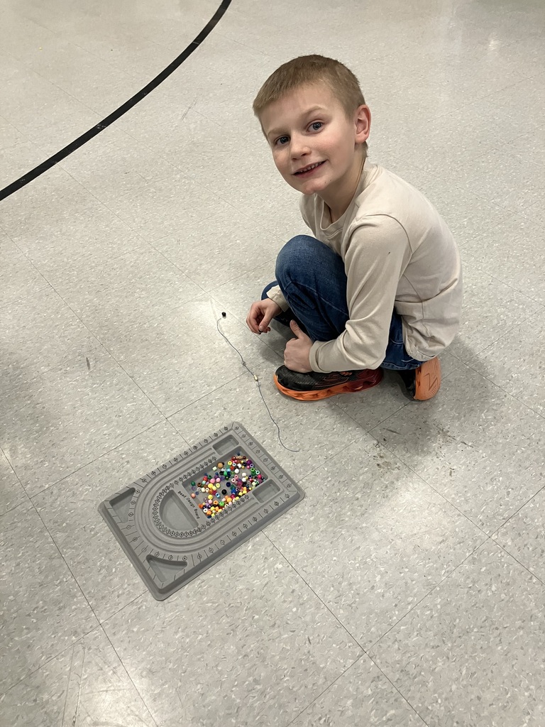 These images capture children engaged in creative jewelry-making and physical activities within a school gymnasium or community center.