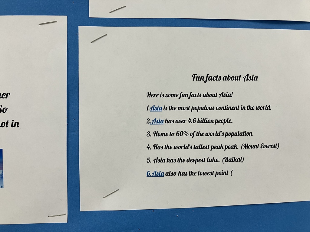 A close-up of the "Fun facts about Asia" slide.  Facts include: Most populous continent (over 4.6 billion people), 60% of the world's population, home to Mount Everest (tallest peak), and Lake Baikal (deepest lake).  Africa IMG_3130: A poster titled "Countries in Africa" listing dozens of nations in alphabetical order, from Algeria to Zimbabwe. Two small photos at the bottom show a line of elephants at a watering hole and a scenic canyon vista.