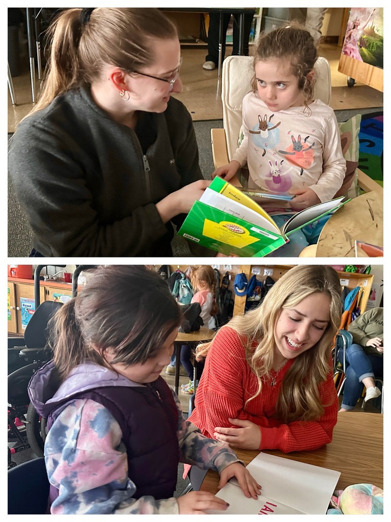 Two high school students sit with a young boy wrapped in a blanket, talking and reading together in a cozy classroom corner.