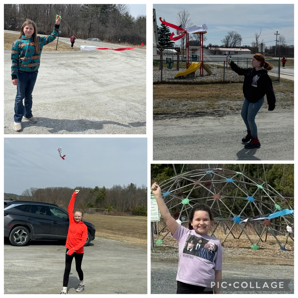 Large Field Activities Top Photo: A young girl in a tie-dye hoodie runs across a dry, grassy field while flying a small white kite with a long red ribbon tail. Another girl stands in the distance holding the kite string reel.  Bottom Photo: A group of children and adults gathered on a field near a soccer goal. Several children are actively flying kites, including one kite with a long red streamer soaring high in the air.  Image 2: Individual Kite Flyers Top Left: A girl in a patterned teal hoodie stands on a gravel path, holding up a green kite string handle. Her white kite with a red tail rests on the ground behind her.  Top Right: A girl in a black hoodie and blue jeans stands on a gravel area, holding a kite string. In the background, a white kite with a red ribbon is caught on top of a playground structure.  Bottom Left: A girl in a bright orange long-sleeve shirt smiles while holding a kite string high above her head. A dark SUV and an open field are visible in the background.  Bottom Right: A close-up of a smiling girl in a purple graphic T-shirt holding a kite string. Behind her is a large metal geodesic dome climbing structure decorated with blue and green accents.