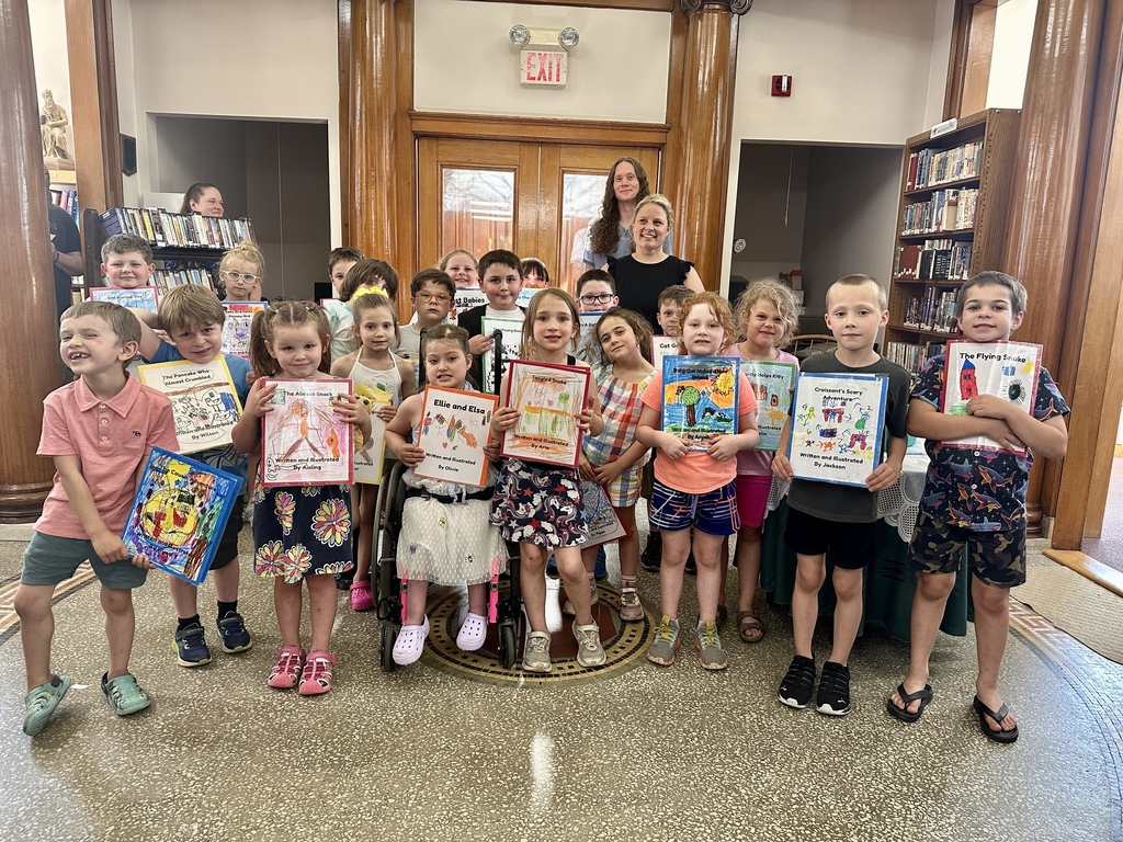 FHGS first graders gather for a group photo at the Fair Haven Free Library, proudly holding their handmade books and displaying their work as young authors.
