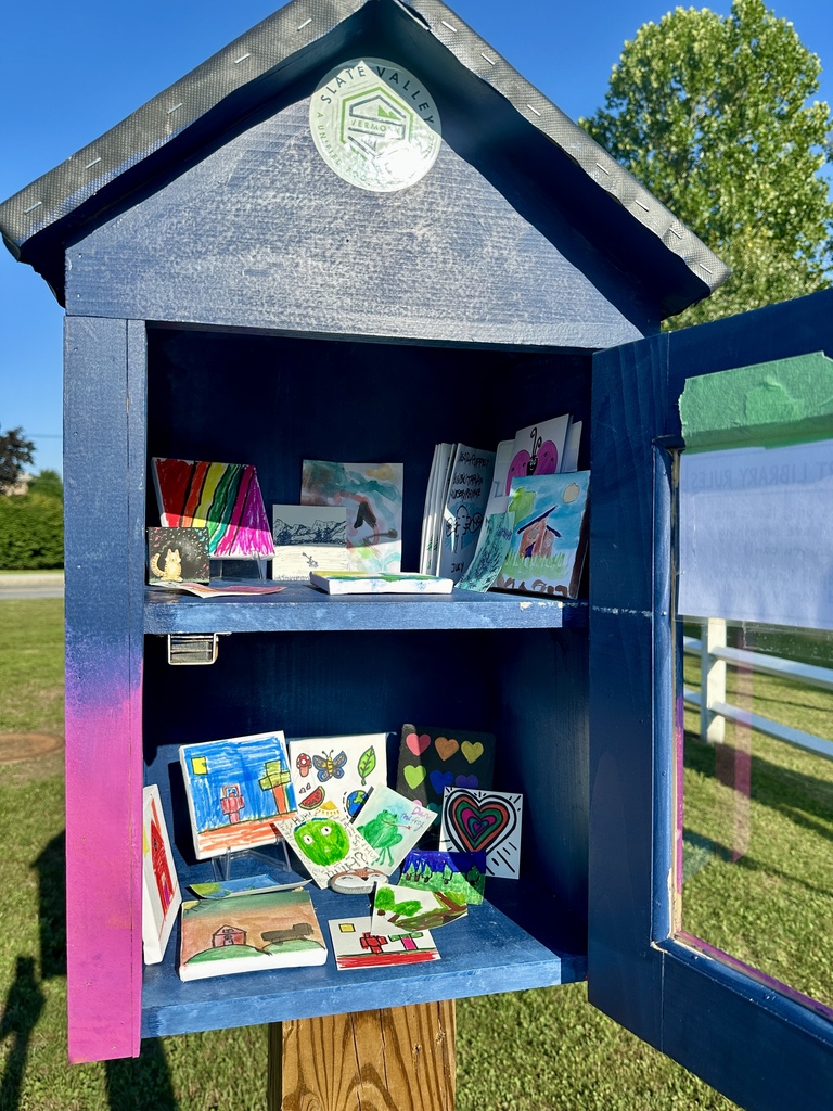 The open Mini Art Gallery is filled with colorful miniature paintings and drawings created by community members during the opening event.