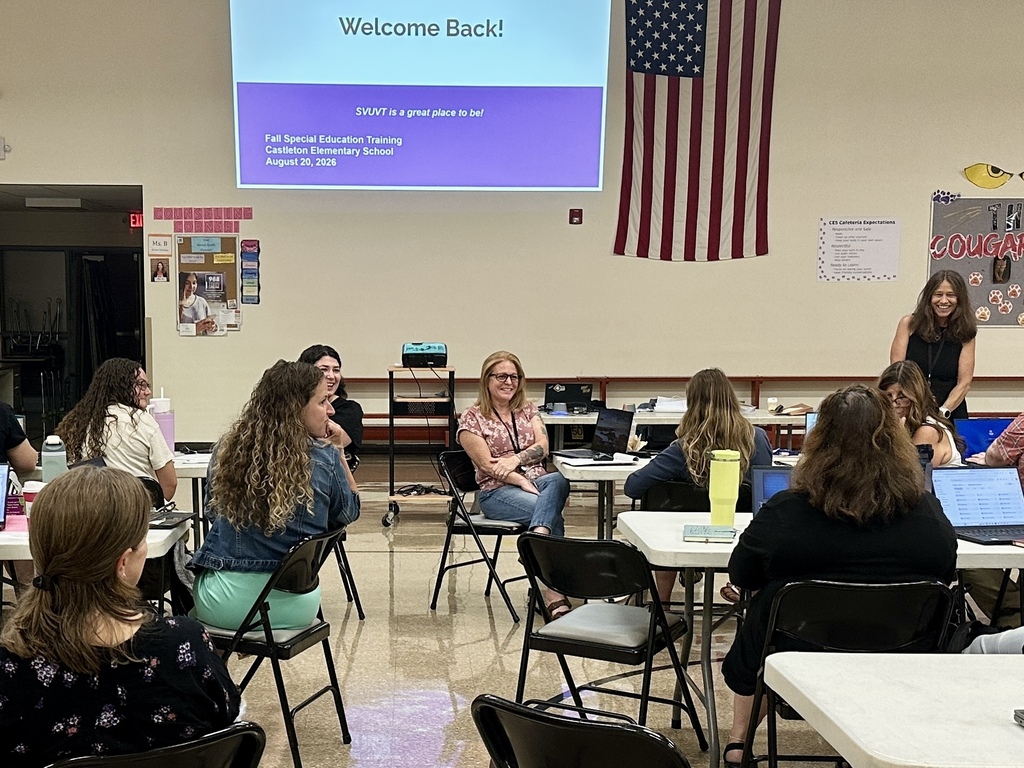 Slate Valley special educators participate in a back-to-school training session with a “Welcome Back!” presentation projected at the front of the room.