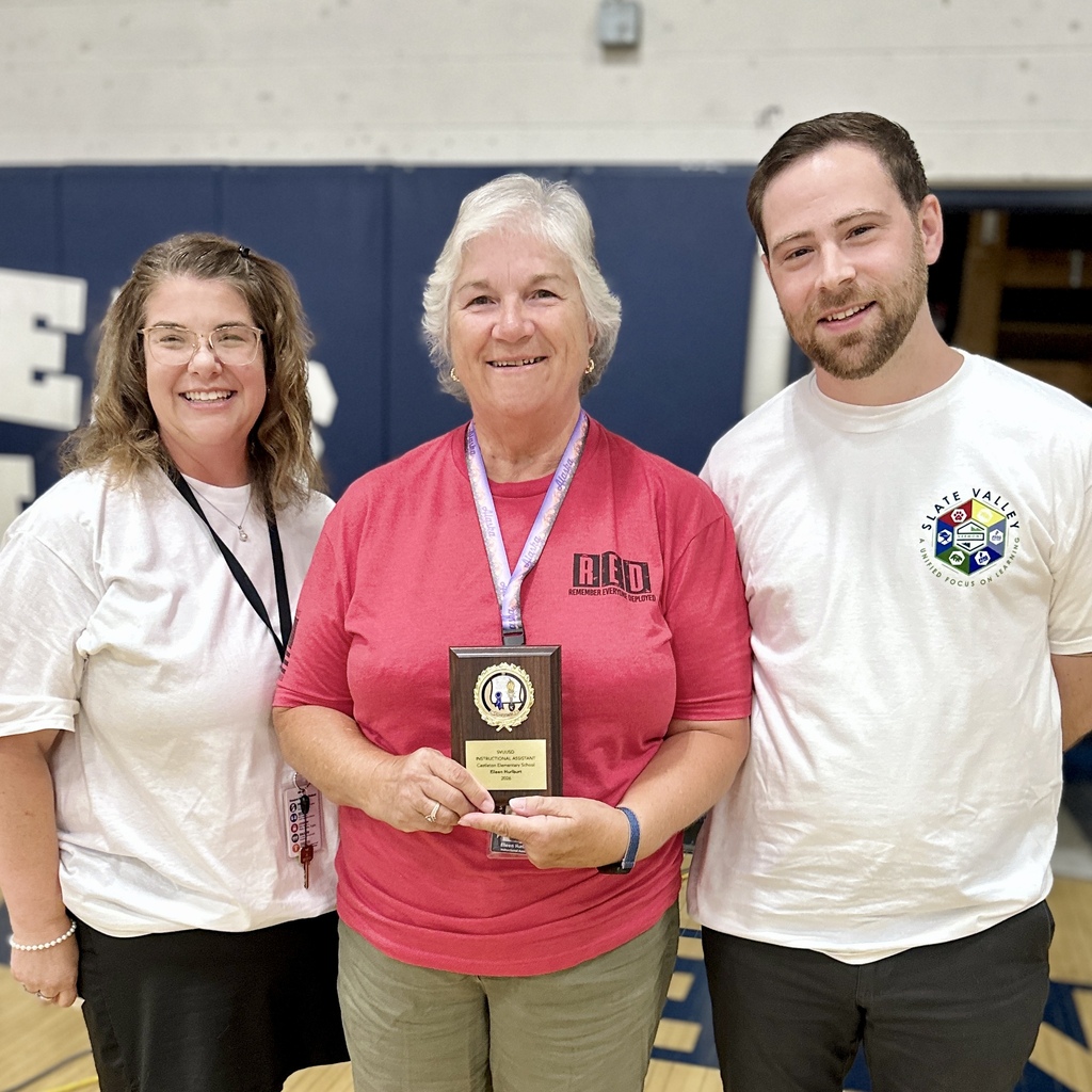 Eileen Hurlburt, CES: Eileen Hurlburt holds her 2026 Instructional Assistant of the Year award while standing with two Castleton Elementary administrators.