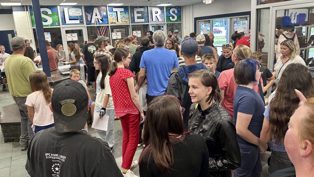 Students and families fill the Fair Haven Union lobby while picking up schedules and preparing to explore the school.