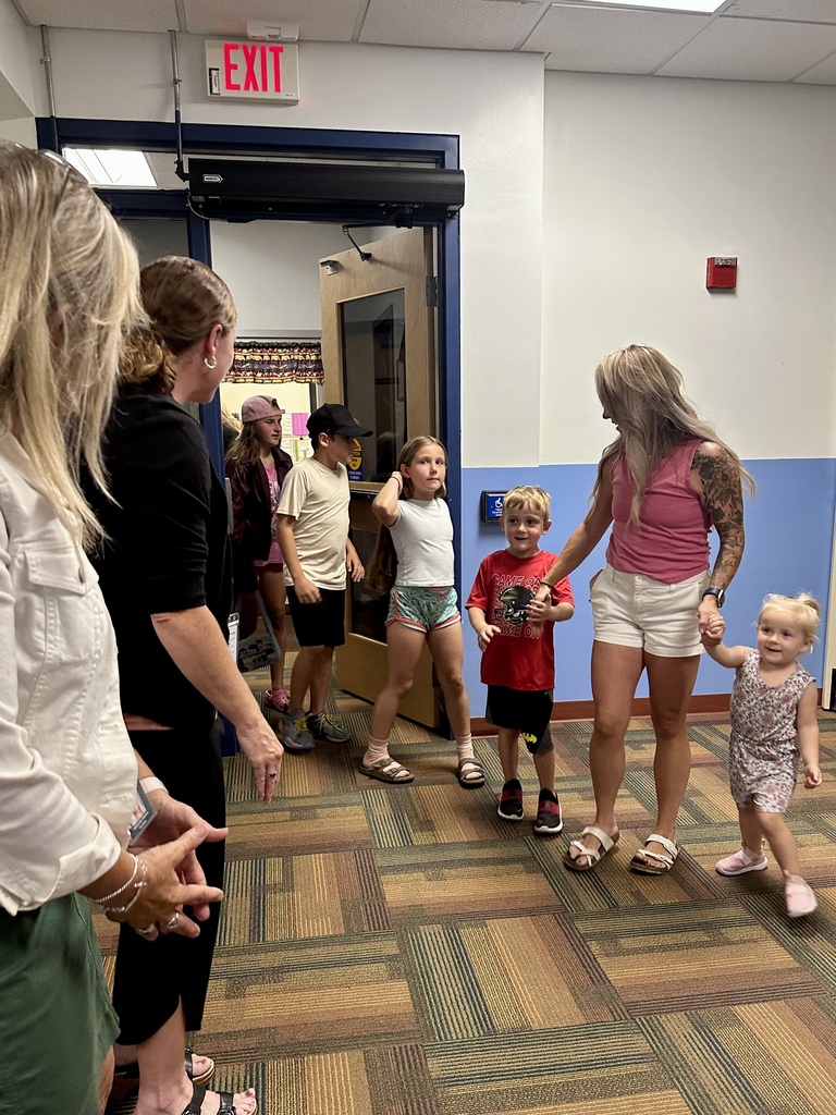 Students and families arrive in a busy FHGS hallway during Open House.