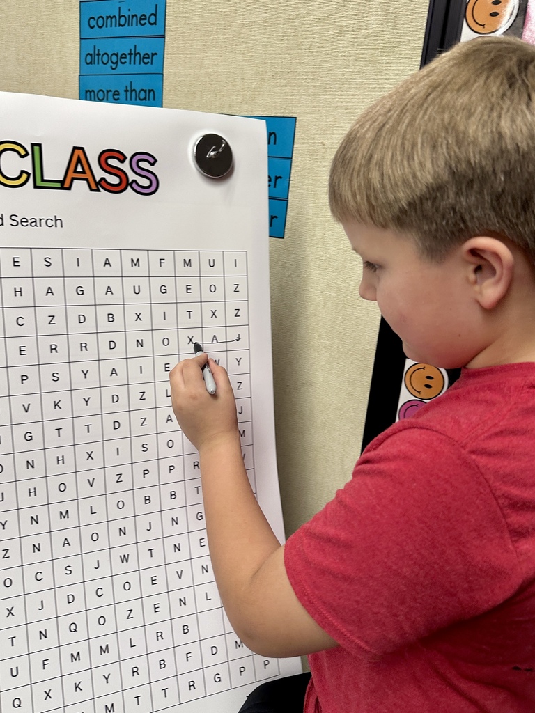 FHGS student completes a classroom word search activity during Open House.