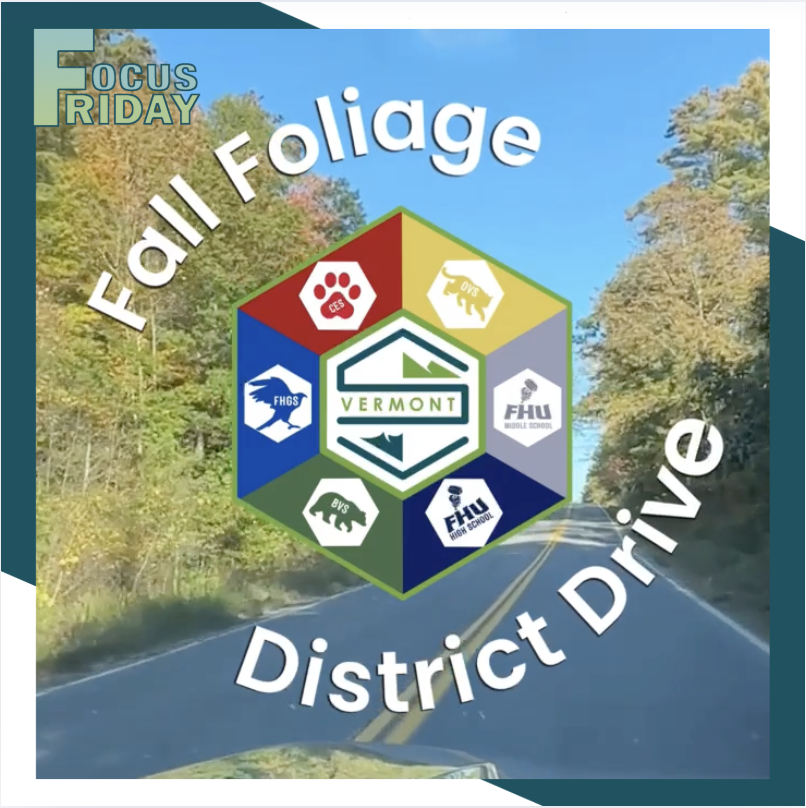 Promotional graphic for "Focus Friday" featuring the text "Fall Foliage District Drive" arched over a central hexagonal Slate Valley district crest. The background shows a winding road surrounded by autumn trees with colorful leaves. The crest at the center displays the Vermont district logo surrounded by individual school emblems, including CES, OVS, FHU Middle School, FHU High School, BVS, and FHGS.