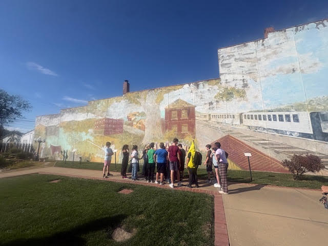 Today, our sixth graders took a walking field trip to Slater Veterans Park to explore the mural in preparation for our upcoming unit on Missouri murals. Students had the opportunity to observe the artwork up close and begin thinking about how murals tell stories, reflect history, and represent a community. It was a beautiful day to get outside, enjoy the sunshine, and explore the artwork!