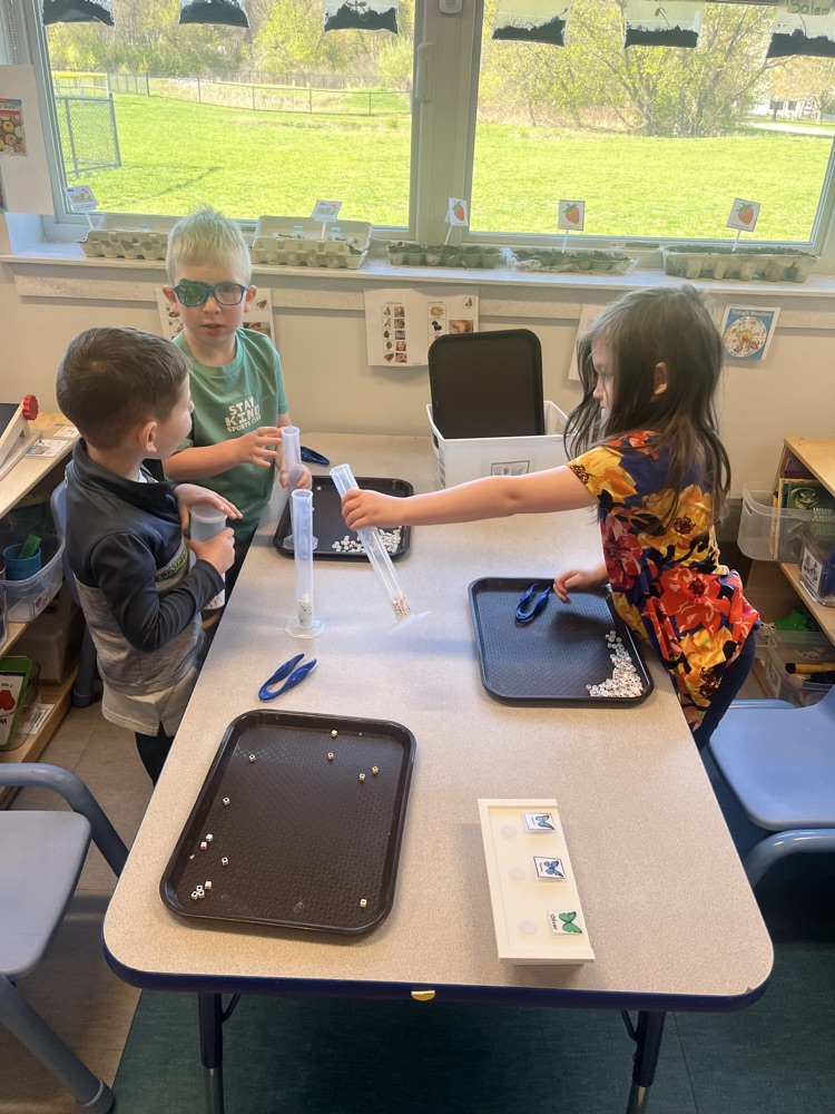 Using tweezers to pick up small objects