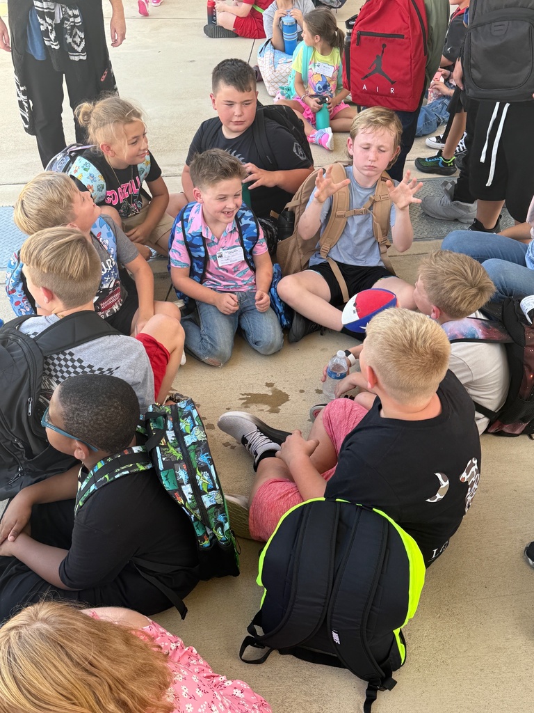 students sitting in circle