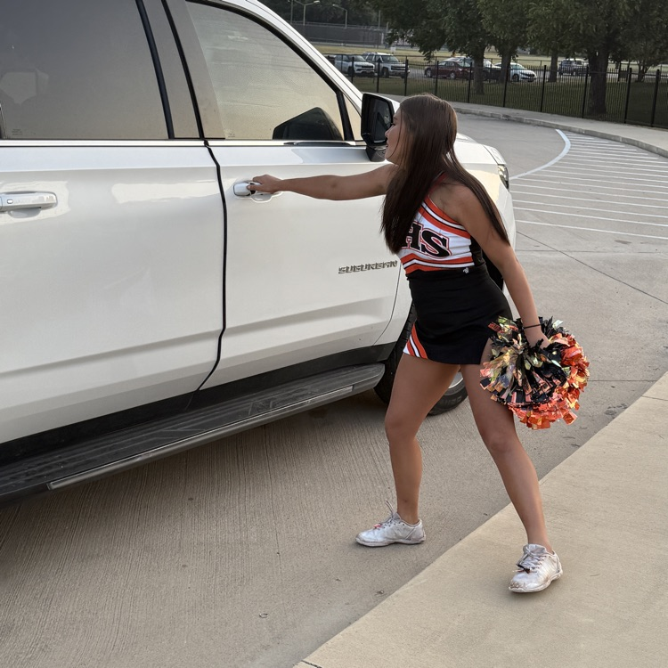 cheerleader opening car door