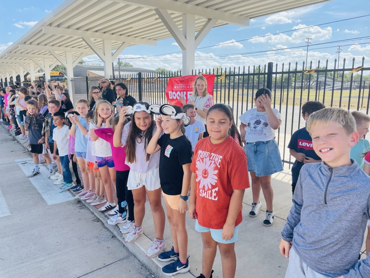 students waiting to wave