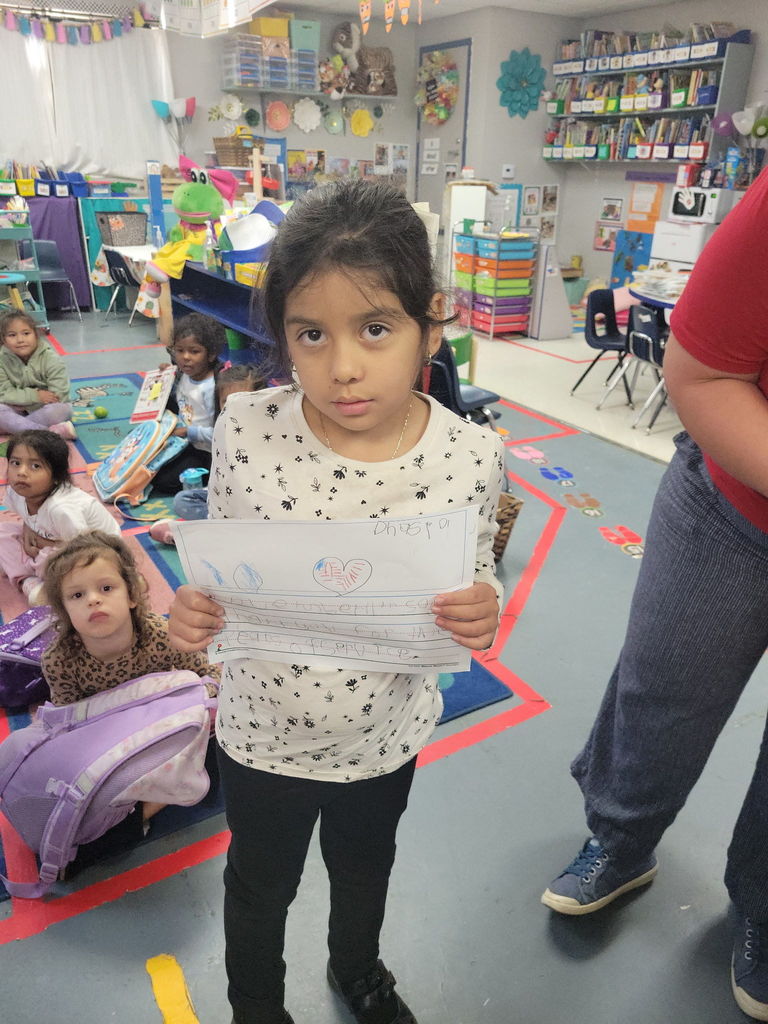 student holding picture