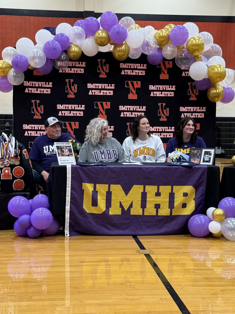 athlete signing paper