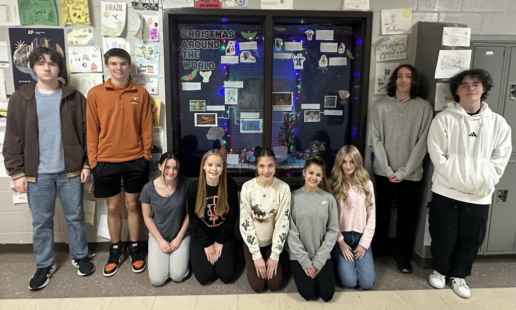 students with wall display