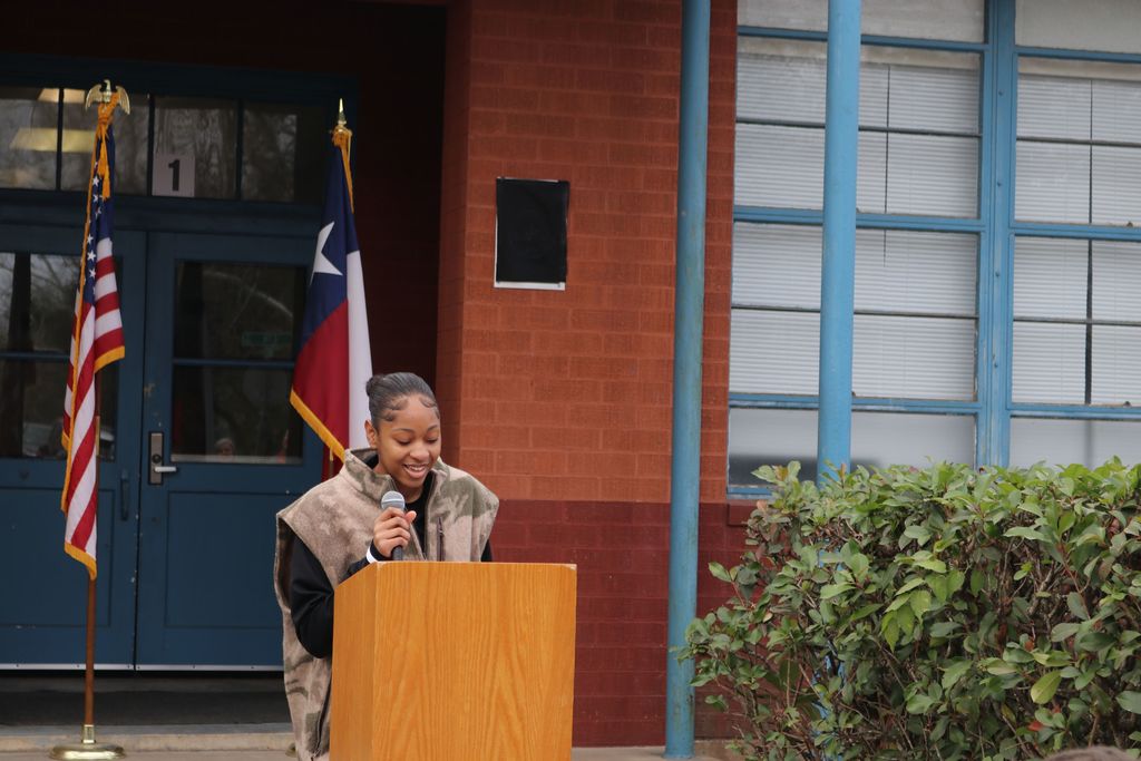 teen talking at podium