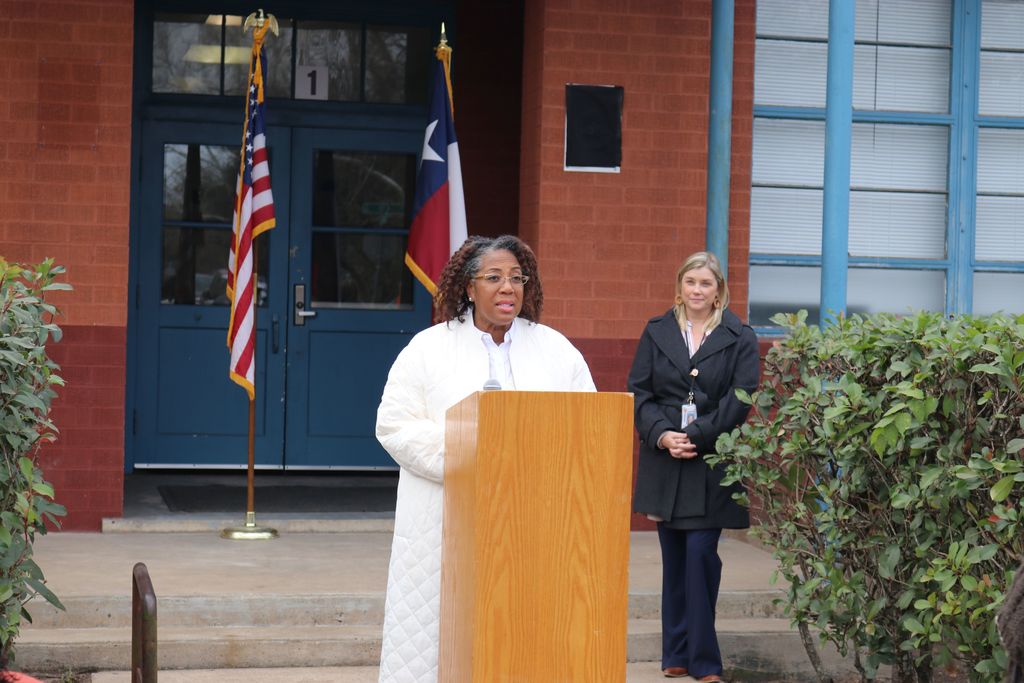 woman talking at podium
