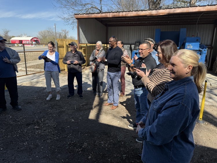spectators clapping and smiling