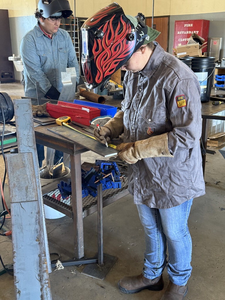 student working in metal fab shop