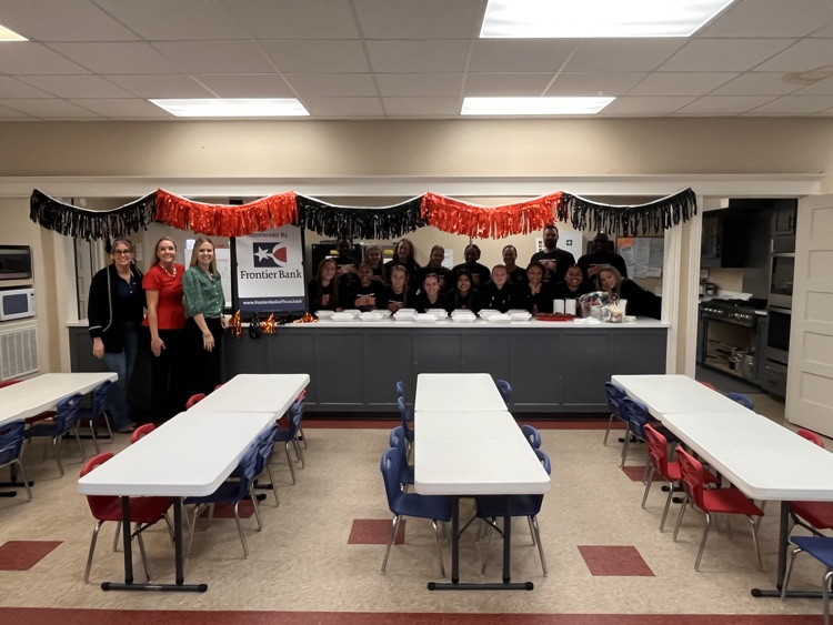 basketball players with Frontier bank employees 