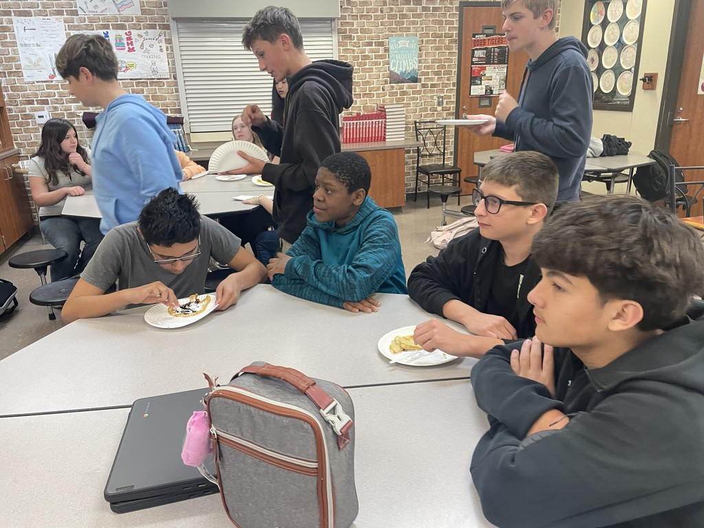 students eating pancakes
