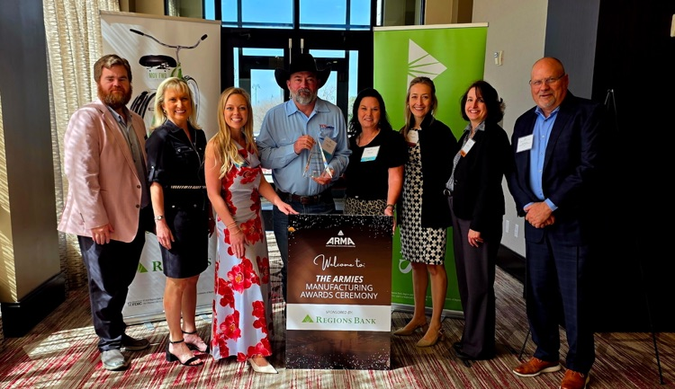 people posing with award