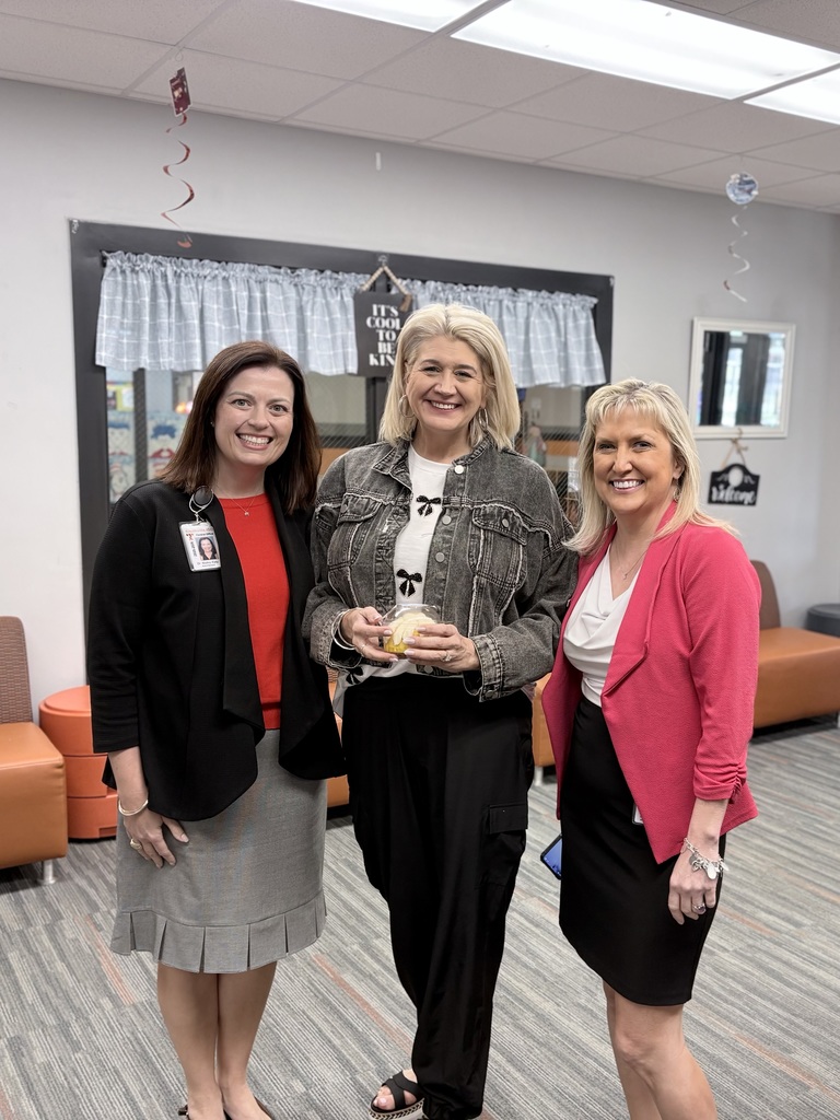 three ladies dressed in business attire