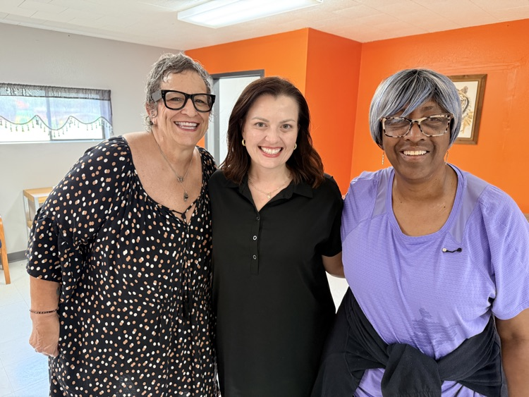 three ladies smiling 