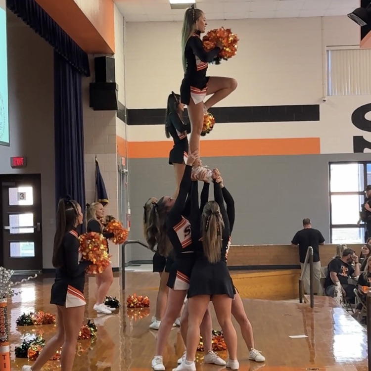 cheerleaders doing a stunt