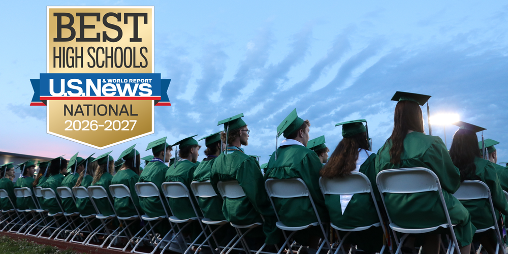 The back of graduates sitting with the logo for US News & World Report Best High Schools logo in the top left corner