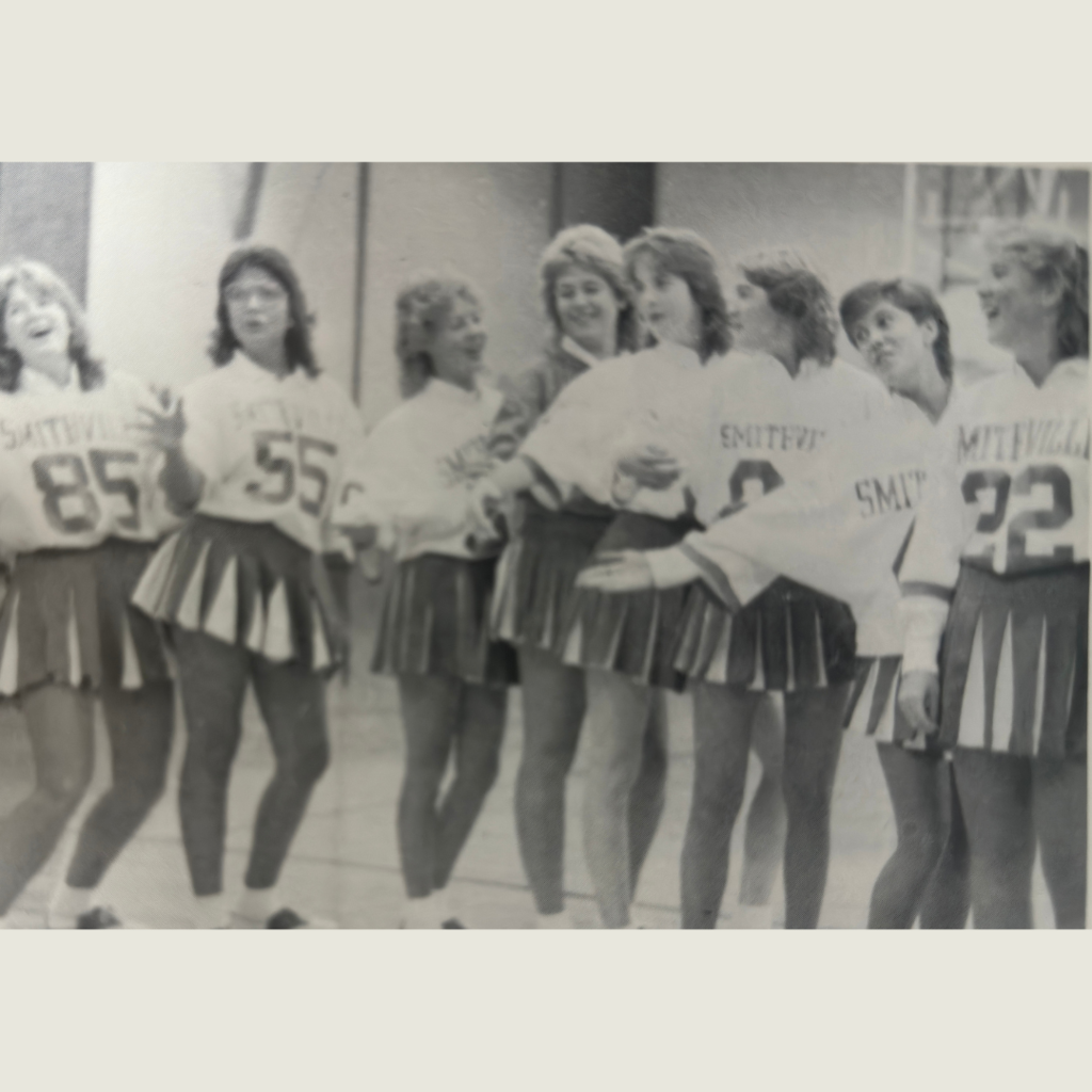 1986 varsity cheerleaders in football jerseys