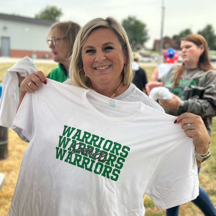 lady holding the free tshirt