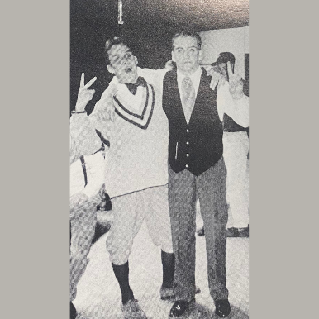 High School boys threw up a peace sign before the curtains rose in 1995.