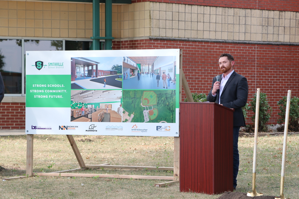Newkirk Novak representative speaking behind  a podium