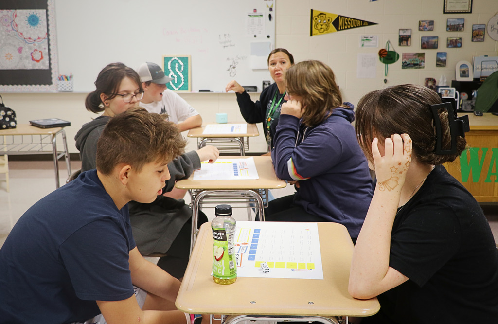 Mrs. boydstens middle school class playing a team building dice game.