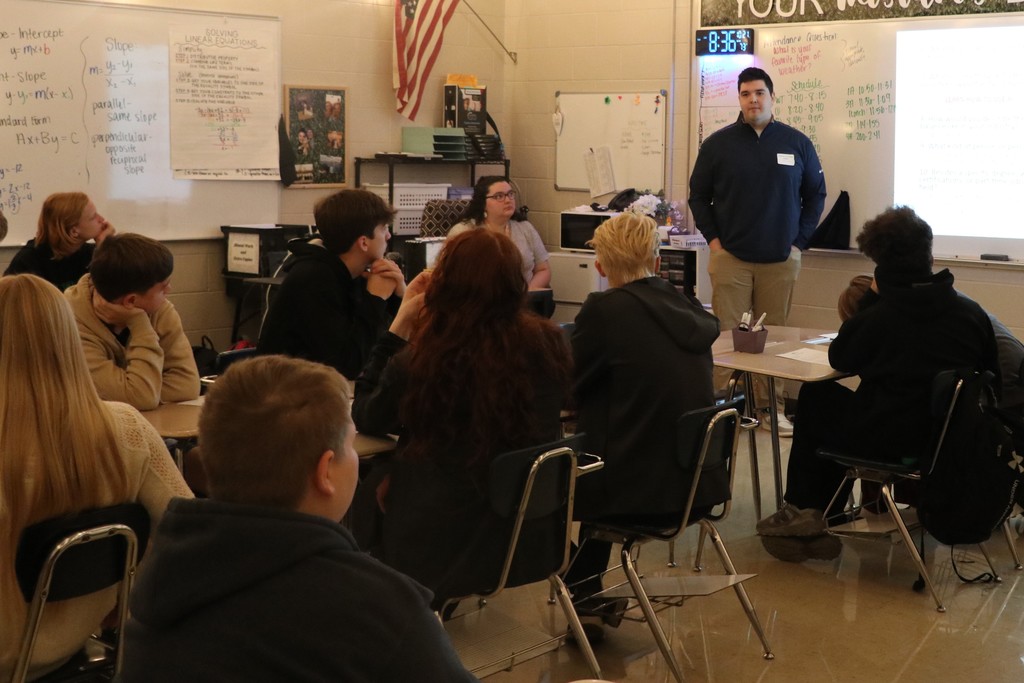 Students listen to a presentation about Information Technology careers at the college and career fair