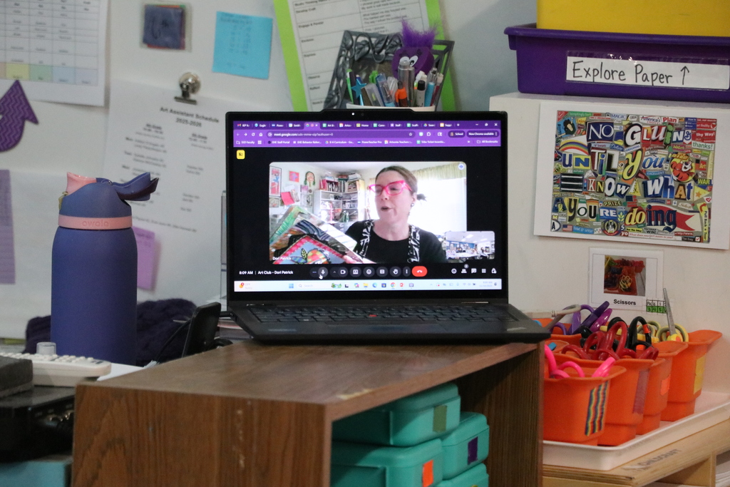 On the screen of a laptop, artist Dori Patrick shares a art journal she created.