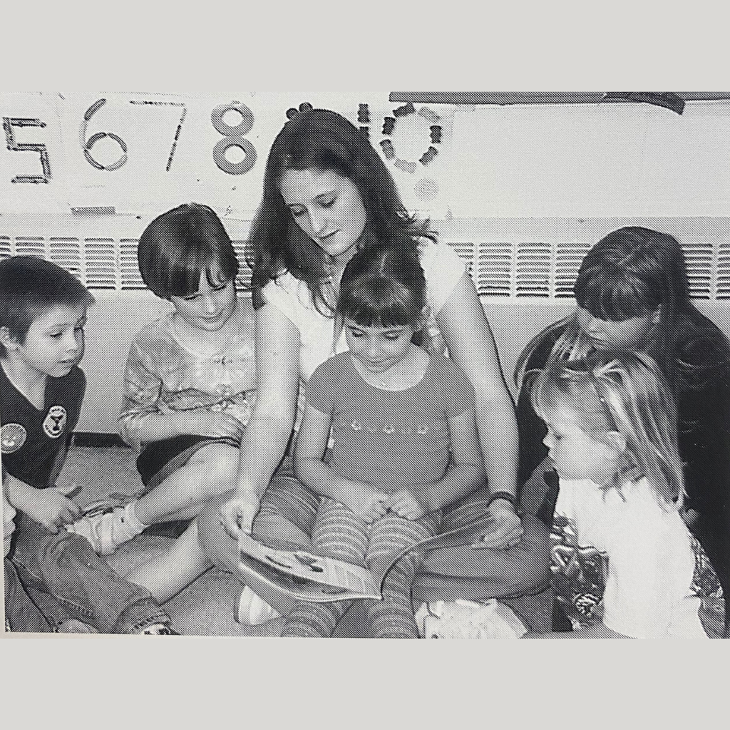 2002, Smithville high school student reading to a kindergarten class for child development.