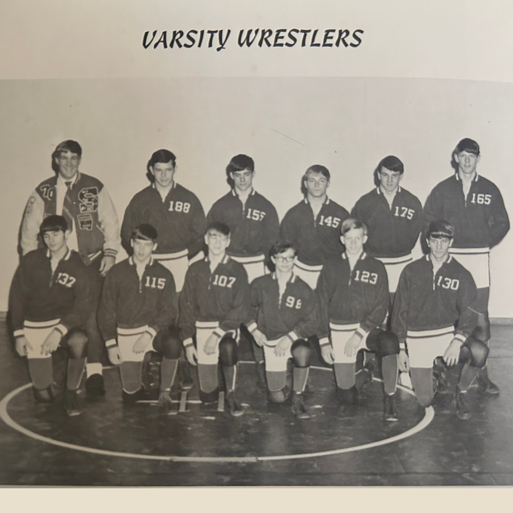 A black and white team picture of the varsity wrestling team from 1970.