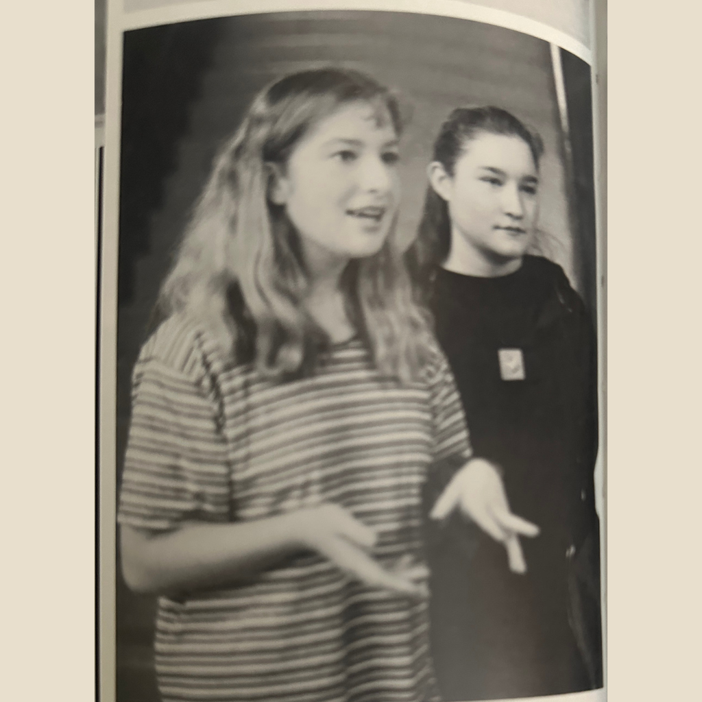 Teenage girl uses her hands to talk when explaining the importance of body language.