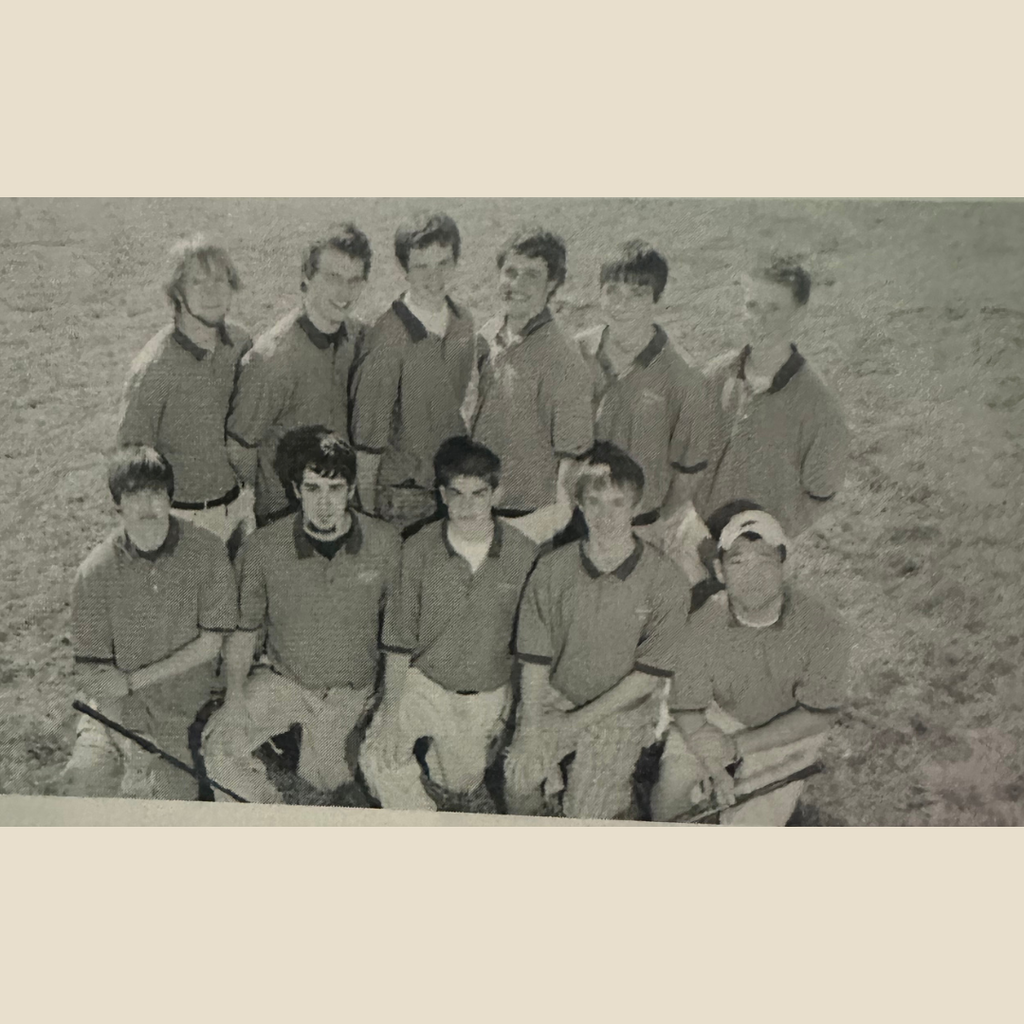 Group of 11 boy golfers lined up for a group picture