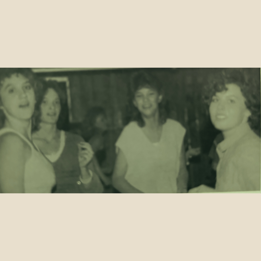 Four girls photographed at the nightly dance at Kirkwood Lodge.