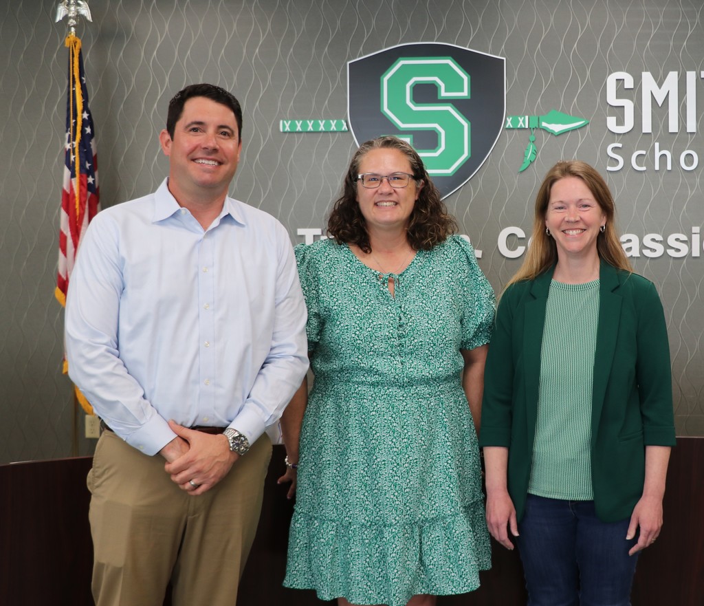Jeff Bauer, Susan Whitacre and Stacia Cudd pose for a picture after being sworn into the Board of Education