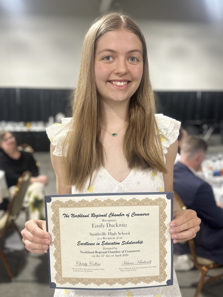Award Recipient poses with trophy
