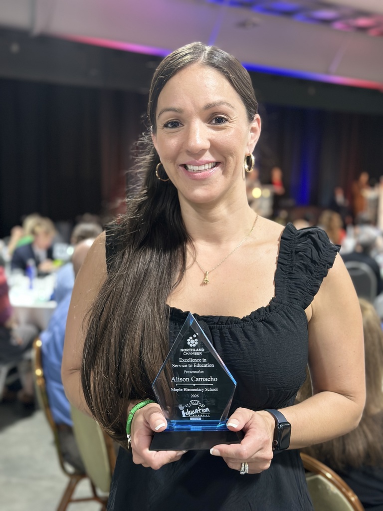Award Recipient poses with trophy